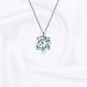 Allison Diamond Drop Necklace by Zomaco on white fabric background - elegant and contemporary design