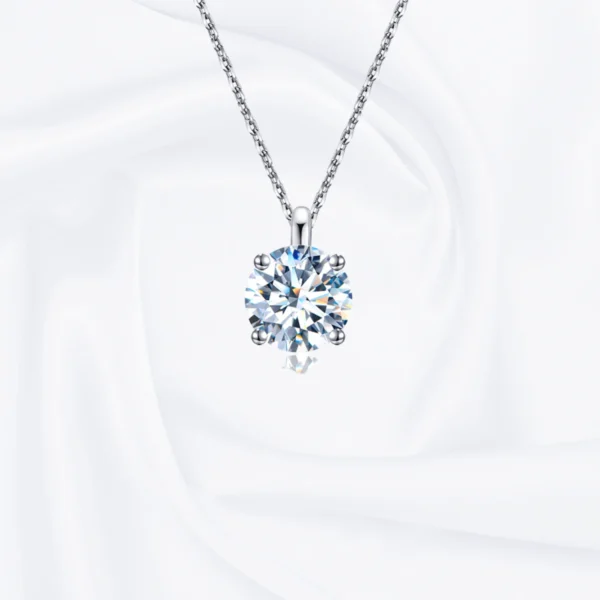 Allison Diamond Drop Necklace by Zomaco on white fabric background - elegant and contemporary design
